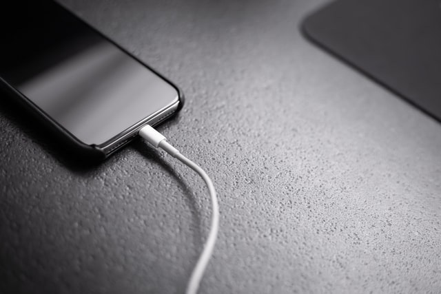 Unplug iPhone from charging port or power bank